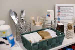 a tray of food sitting on a table with utensils at B_B La Rugiada in Tigliole