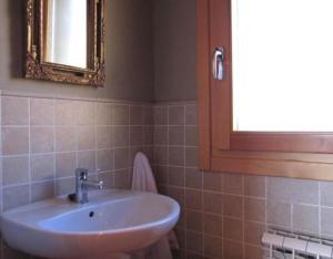 a bathroom with a sink and a mirror at Vivir en el Campo in Cidones +11 photos