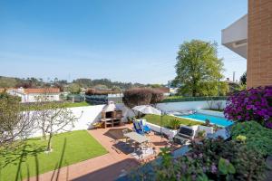 an aerial view of a backyard with a swimming pool at Archer'shouse - Olival's Treasure in Olival