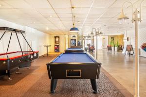 a billiard room with two pool tables in it at Gemütliche Fewo im schönen Harz in Braunlage