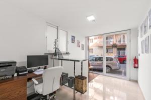 an office with a desk with a computer and a chair at Vima Lofts in Torrevieja