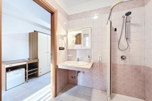 a bathroom with a sink and a shower at Santangelo in Monte SantʼAngelo +291 photos