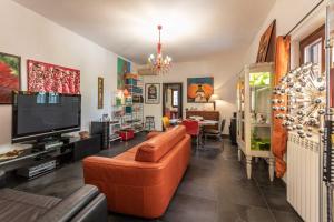 a living room with a couch and a television at Villa Sole With Pool and Sauna in Lecce