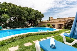 a swimming pool in the yard of a house at Art Gallery House in La Cala de Mijas