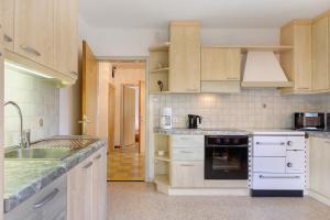a kitchen with a sink and a stove top oven at Unterzerunhof 2 in Laion