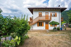a house with a balcony on top of it at Apartment Villa Irma in Levico Terme