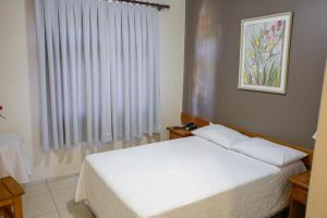 Postel nebo postele na pokoji v ubytování Hotel Abib