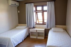Postel nebo postele na pokoji v ubytování Hotel Abib