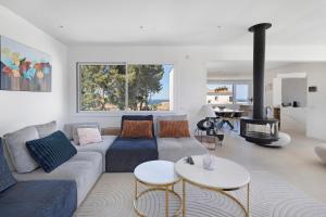 a living room with a couch and a fire place at Blava in Begur