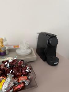 a table with a tray of candy and a microwave at Residenza San Rocco in Pedemonte +26 photos