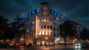 a large building with blue lights on top of it at Residency NO7 in Berlin