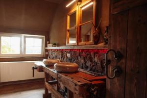 a kitchen with a counter with two bread bowls on it at Villa Sand in Bad Emstal +37 photos