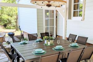 a wooden table with chairs on a porch at Villa Sand in Bad Emstal