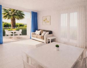 a living room with a couch and a table at ALBACHIARA INN Residence Apartments in Ameglia