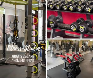 a gym with dumbbells and fitness equipment at Villa Sand in Bad Emstal