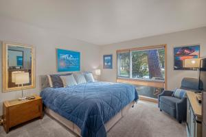 a bedroom with a bed and a couch and a tv at 76 Meadow House in Sunriver +19 photos