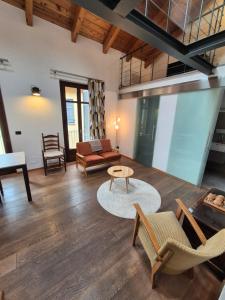 a living room with a couch and a table at Urban Loft Duomo in Alba +15 photos