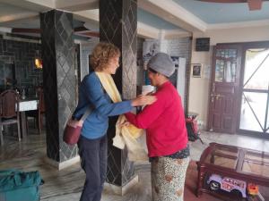 a woman standing next to a man in a room at Hotel Garangja in Bandipur