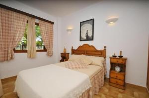 a bedroom with two beds and a window at Cora in Alcudia