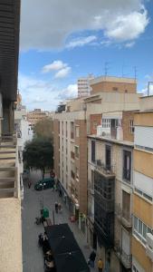 a view of a street in a city with buildings at Jaén Delice Deluxe & Parking in Jaén