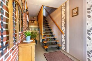 a spiral staircase in a home with a stair case at Haus Dreeßen in Buchholz