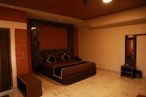 a bedroom with a bed in a room at The Den by Trees in Kotagiri +79 photos