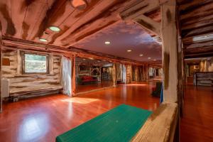 an empty living room with wooden walls and wood floors at Lapon H10 in Hauteluce