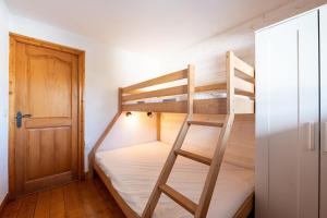 a bunk bed room with two bunk beds and a door at Lapon H10 in Hauteluce +21 photos