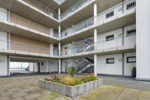an apartment building with balconies and a courtyard at Seeschwalbe in Olpenitz