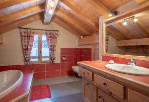 a bathroom with a sink and a mirror at Ferme Le Coup d'Oeil in Taninges +74 photos