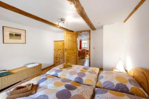 a bedroom with a large bed in a room at Ferienwohnung Gartenfreude in Veckenstedt