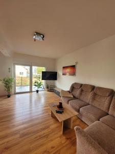 a living room with a couch and a coffee table at Ferienhaus Schw Agnes in Warin