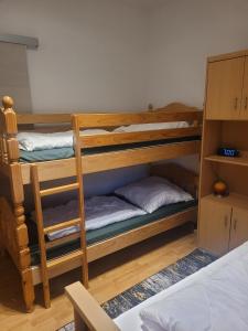 two bunk beds in a room with a bed at Ferienhaus Schw Agnes in Warin