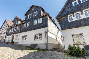 a group of buildings on a cobblestone street at Fewo45 in Homberg
