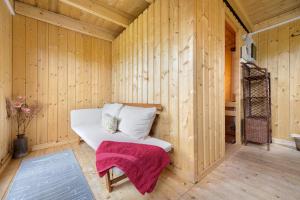 a wooden room with a bench in a sauna at Ferienhäuser Stickel in Freudenstadt