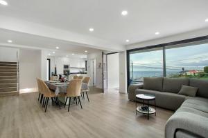 a living room with a couch and a table at Villa Angela in Funchal