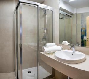 a bathroom with a sink and a shower at Villa Athena in Giardini Naxos +13 photos