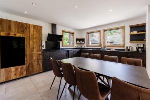 a dining room with a large table and chairs at Lamartine in Valloire