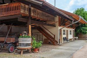 a building with a staircase and a house at Ferienwohnung im Gehöft in Müllheim