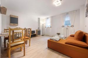 a living room with a couch and a table at Veith in Hildesheim