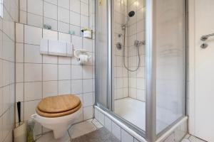 a bathroom with a toilet and a shower at Veith in Hildesheim +12 photos