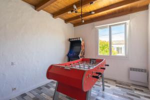 a red foosball table in a room at Villa Cap mer 17 in Saint-Palais-sur-Mer