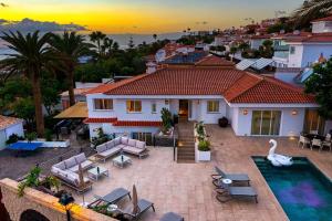 an aerial view of a house with a swimming pool at Villa Ginevra in Arona