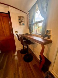 a home office with a desk and a chair at Alices Garden Two in York