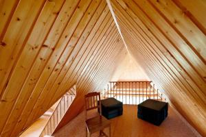 an overhead view of a room in a wooden attic at Wellness Ferienwohnung Müller in Rostock +28 photos