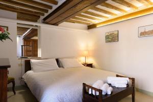 Llit o llits en una habitació de Suite 19zero3