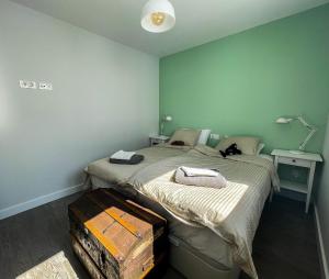 a bedroom with a bed with a suitcase next to it at Atico Bremadito in Torrox Costa