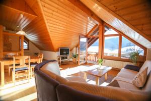 a living room with a couch and a table at Appartment Bergblick in Bernau im Schwarzwald