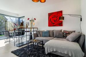 a living room with a couch and a table at Design Apartment Mettnaublick in Radolfzell am Bodensee