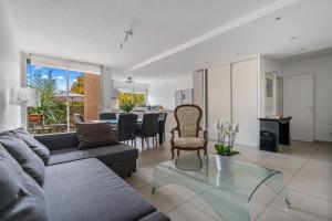 a living room with a couch and a table at Terrasse de Malissol in Vienne